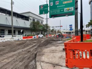 Western-facing view of construction in the westbound lanes of E. Twiggs Street as eastbound traffic is maintained  